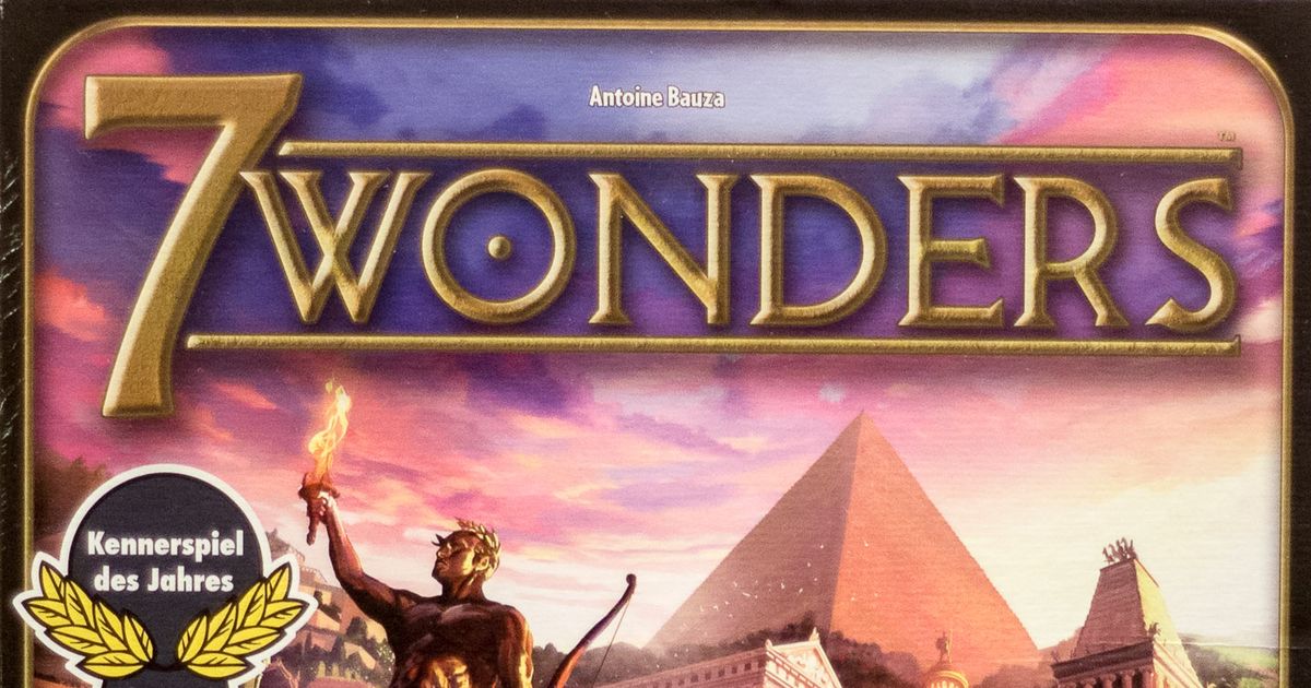 Box cover art for 7 Wonders, showing an illustrated ancient wonder under construction with cranes and workers against a golden sky.
